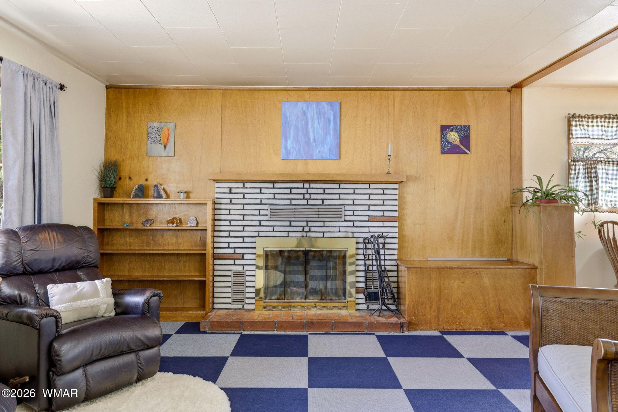 438 East Yaqui Street Springerville, AZ 85938 - Photo 8 of 31 a living room with furniture and a fireplace