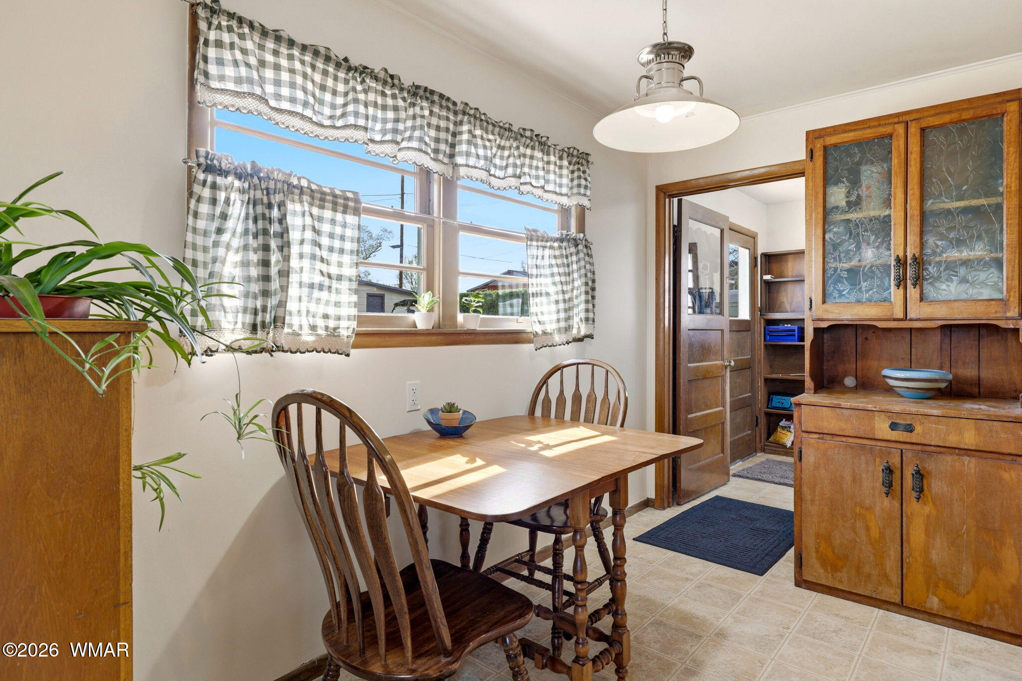 438 East Yaqui Street Springerville, AZ 85938 - Photo 10 of 31 a view of a dining room with furniture window and outside view