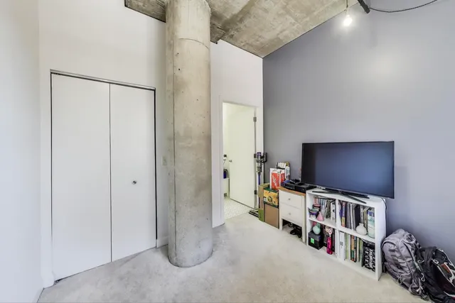 a room with furniture and a flat screen tv