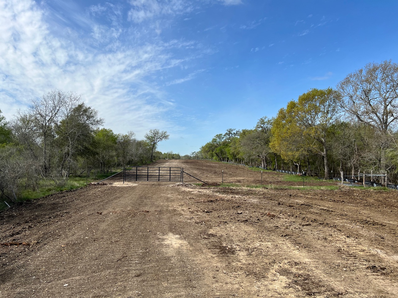 Tbd Cunningham Drive Lockhart, TX 78644 - Photo 15 of 15 a view of dirt field with trees in the background