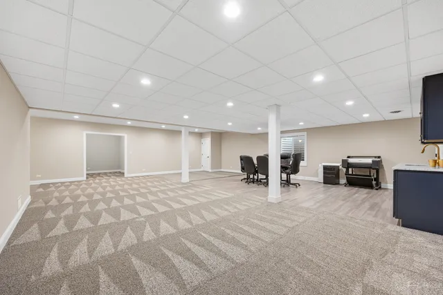 a view of kitchen with cabinets