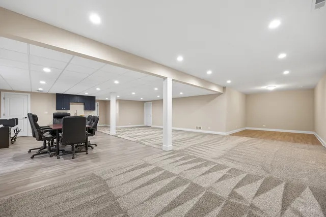 a view of kitchen with granite countertop cabinets and wooden floor