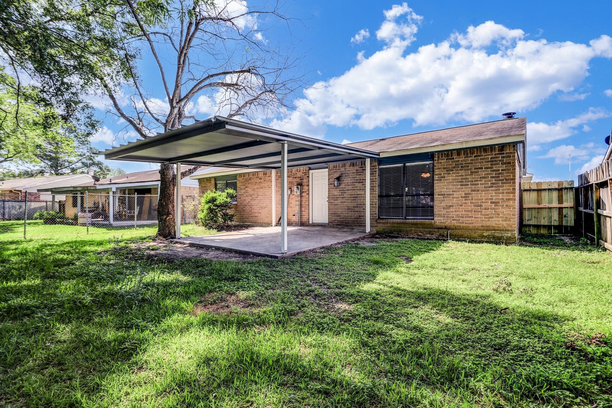 14107 Pinewest Drive Houston, TX 77049 - Photo 10 of 10 a front view of a house with garden