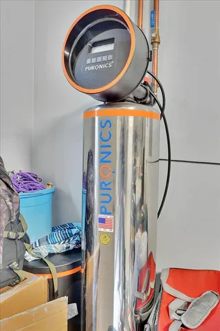 a kitchen with a sink a stove and chairs