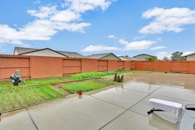 a backyard of a house with yard and garage