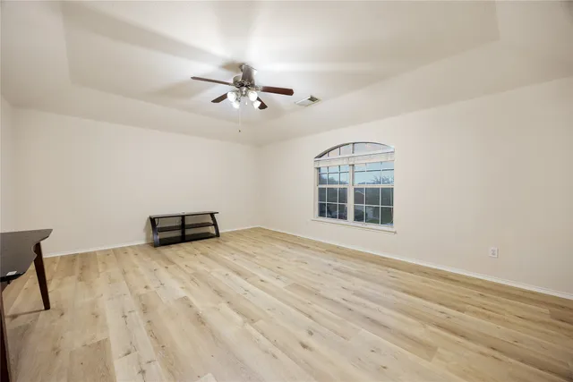 a view of an empty room with a window