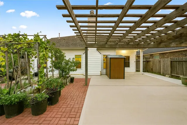a yellow room with potted plants in front of it