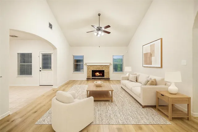 a living room with furniture and a fireplace