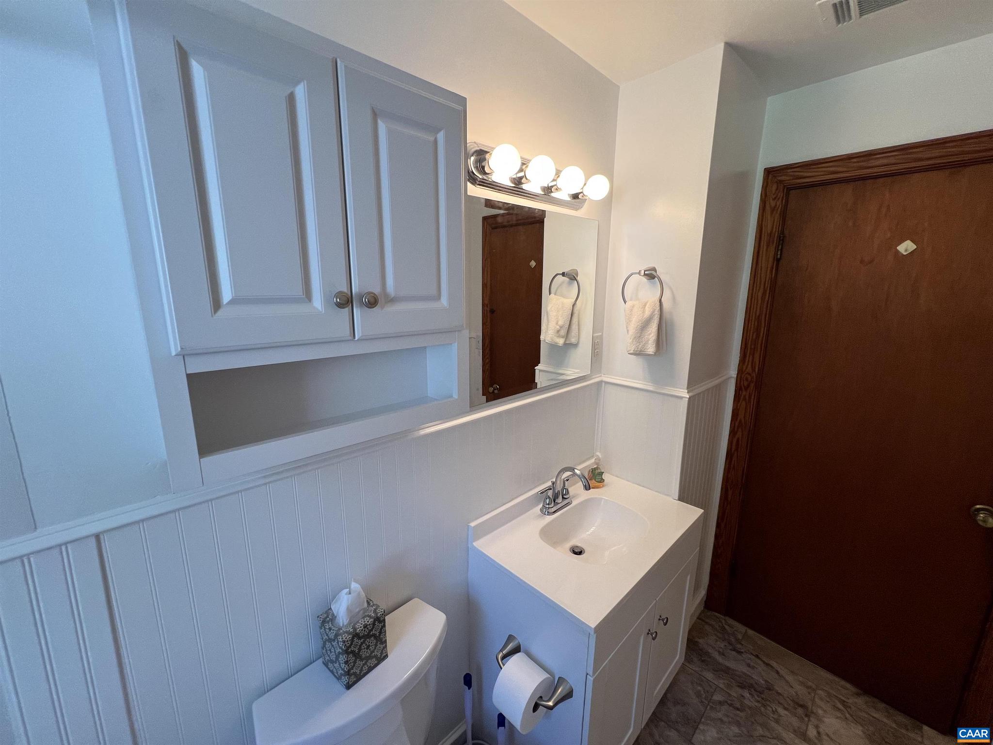 1320 Avon Street Charlottesville, VA 22902 - Photo 18 of 40 a bathroom with a sink vanity and mirror