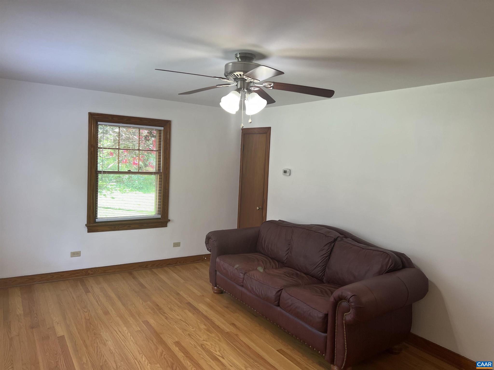 1320 Avon Street Charlottesville, VA 22902 - Photo 5 of 40 a living room with furniture and a chandelier
