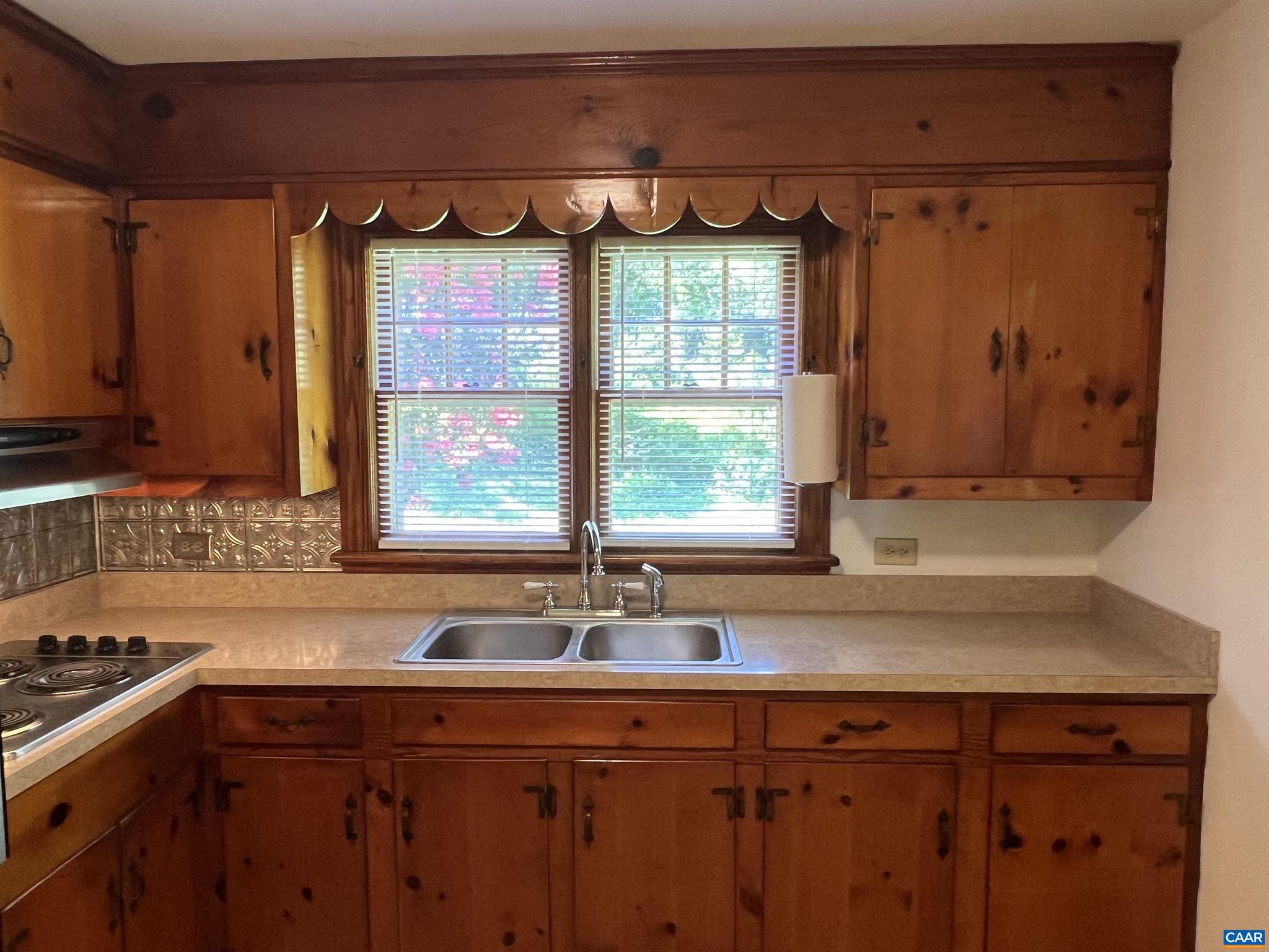 1320 Avon Street Charlottesville, VA 22902 - Photo 10 of 40 a view of a sink a window and cabinets