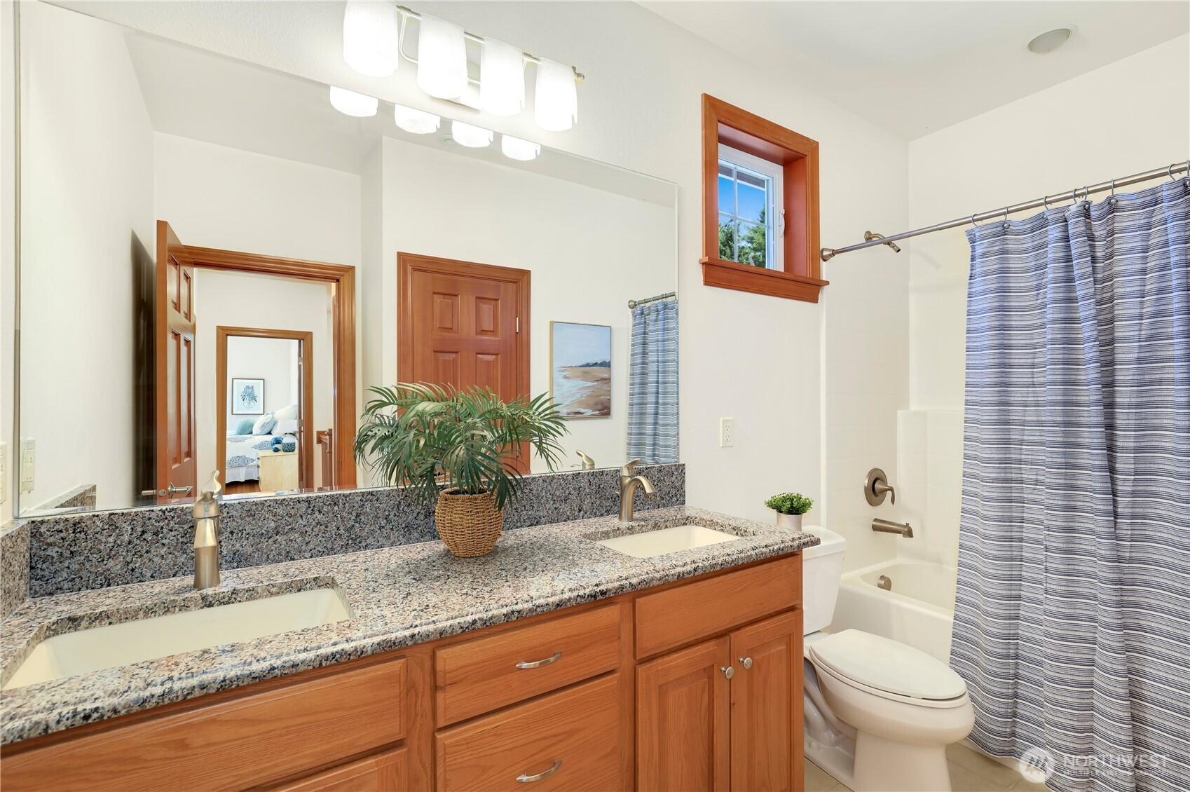 34730 Northeast 82nd Place Carnation, WA 98014 - Photo 31 of 40 a bathroom with a granite countertop sink a toilet and a large mirror