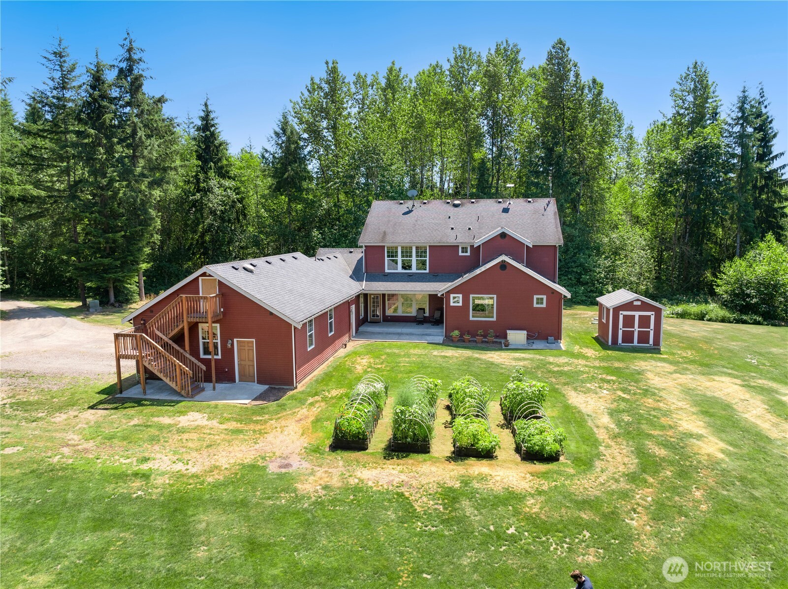 34730 Northeast 82nd Place Carnation, WA 98014 - Photo 34 of 40 a view of a house with a yard and trees
