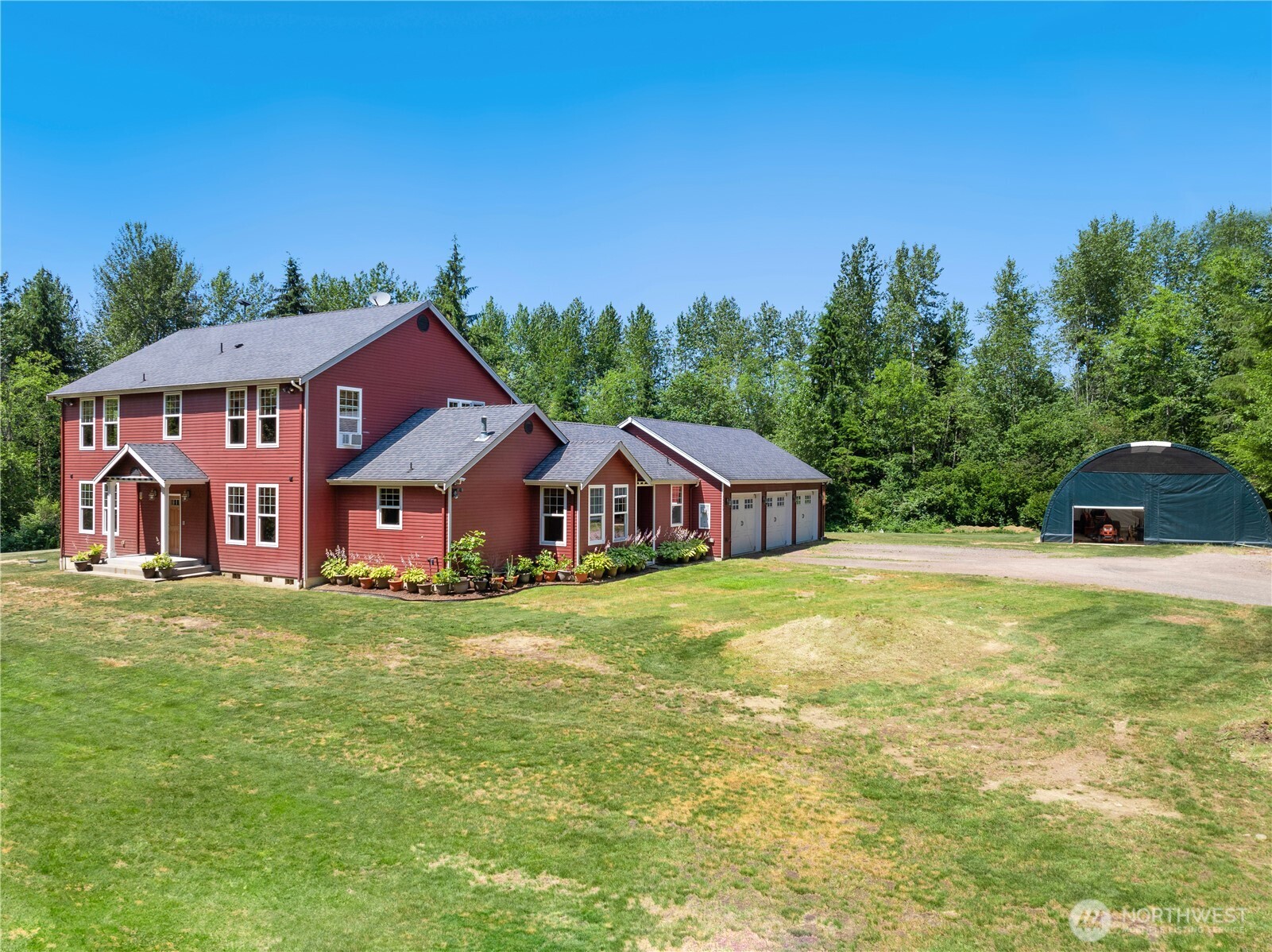 34730 Northeast 82nd Place Carnation, WA 98014 - Photo 4 of 40 a front view of a house with garden
