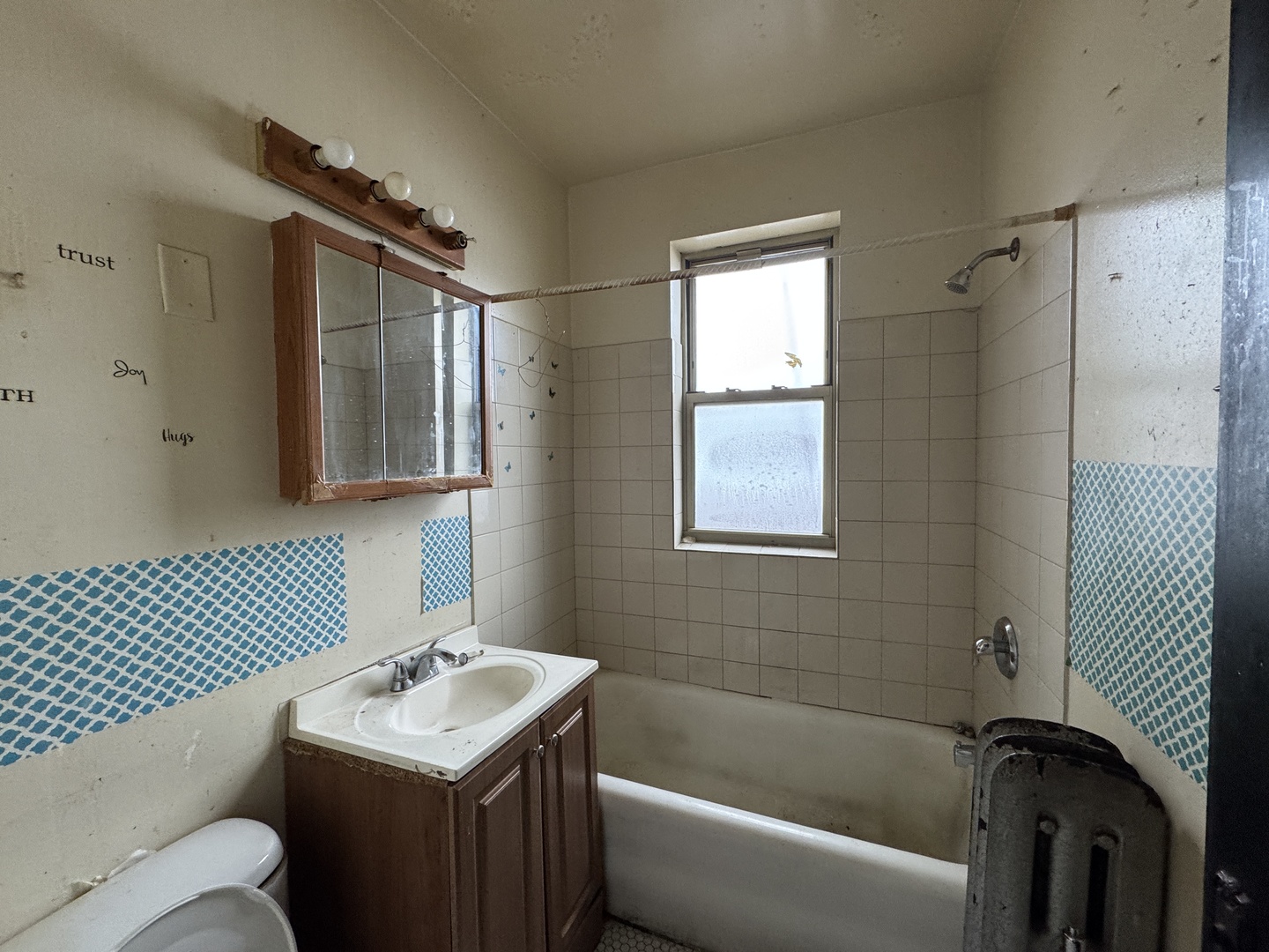 605 East 80th Street Chicago, IL 60619 - Photo 8 of 13 a bathroom with a sink toilet shower and bathtub