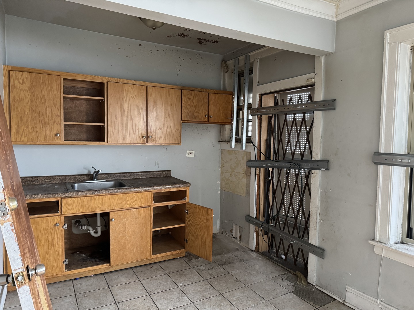 605 East 80th Street Chicago, IL 60619 - Photo 9 of 13 a kitchen with stainless steel appliances granite countertop a stove and a refrigerator