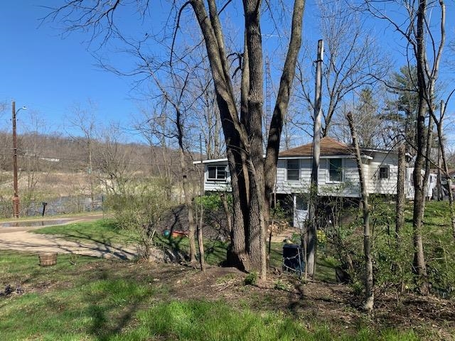 a backyard of a house with lots of green space