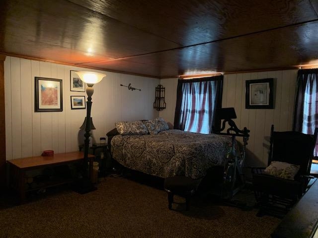 1977 # 11 N 3103 Roads Ottawa, IL 61350 - Photo 6 of 12 a bed sitting in a bedroom next to a window