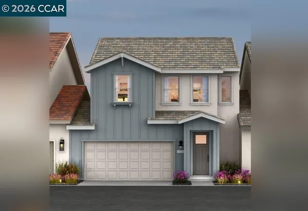 a front view of a house with garage