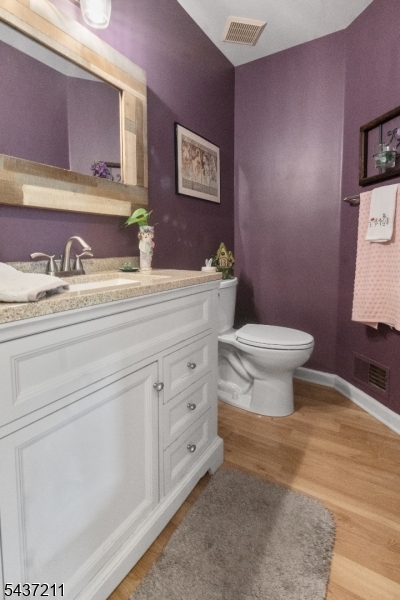 3701 Park Place Springfield, NJ 07081 - Photo 8 of 38 a bathroom with a toilet sink and mirror