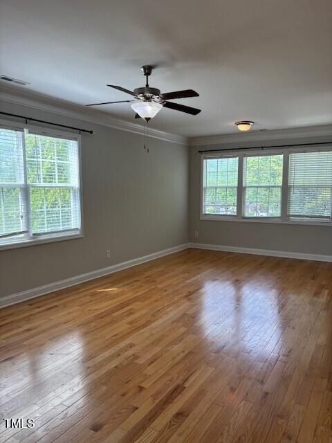 200 Presenteer Trail Apex, NC 27539 - Photo 7 of 17 a view of an empty room with wooden floor and a window