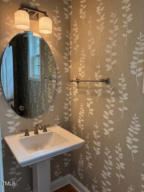 200 Presenteer Trail Apex, NC 27539 - Photo 9 of 17 a bathroom with a sink and a mirror