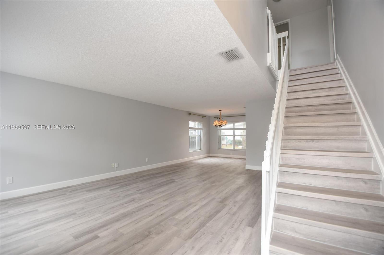 4801 Grapevine Way, Unit 4801 Davie, FL 33331 - Photo 4 of 32 a view of entryway and hall with wooden floor