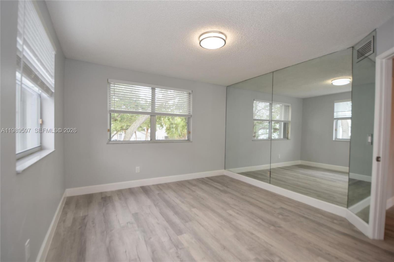 4801 Grapevine Way, Unit 4801 Davie, FL 33331 - Photo 5 of 32 an empty room with windows