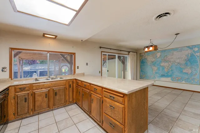 a kitchen with a sink and cabinets