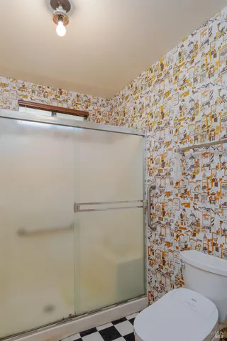 a bathroom with a toilet and a sink