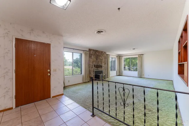 a view of a hallway with windows