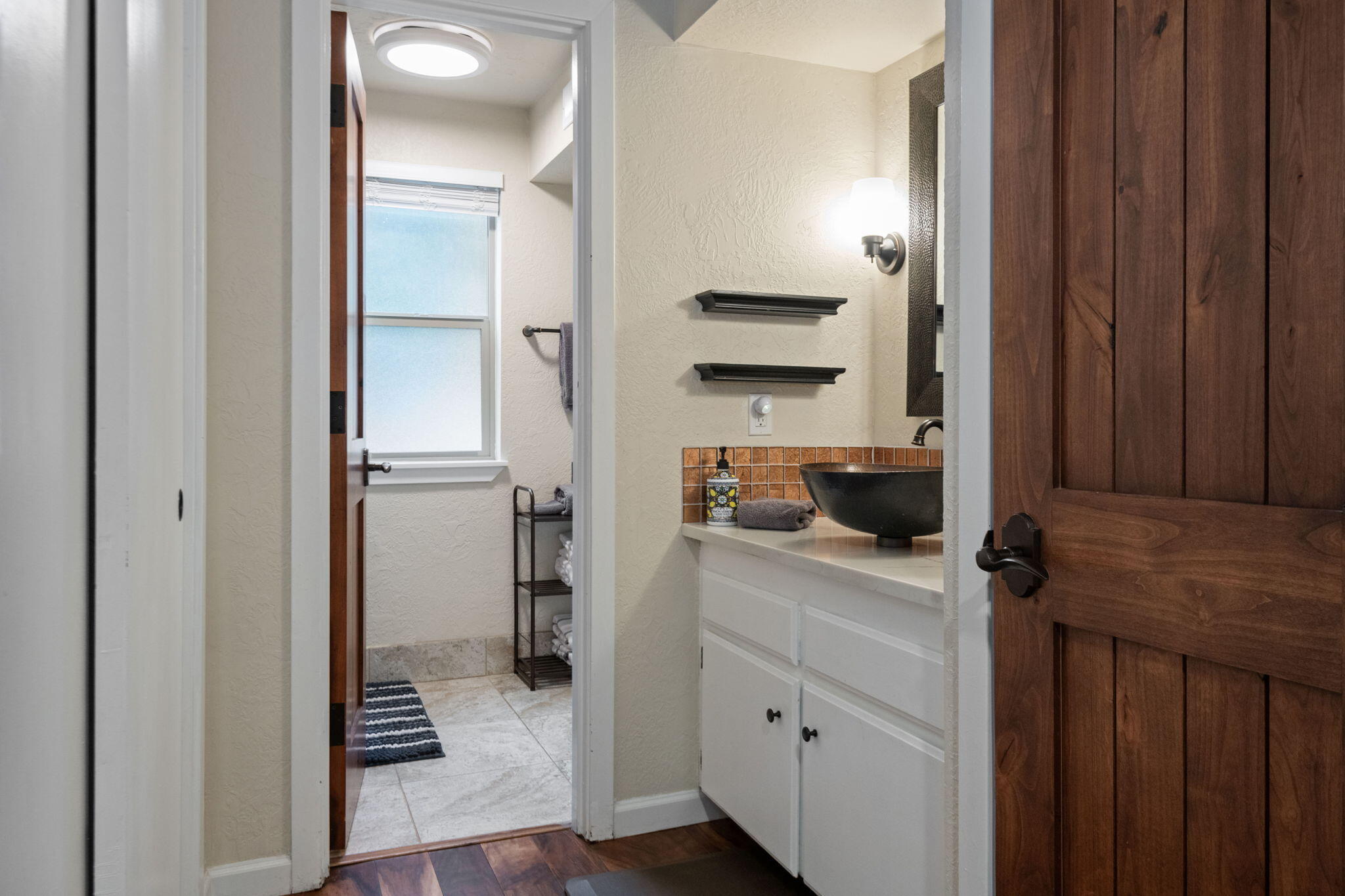 17654 Pinnacle Lane, Unit 16 Sunriver, OR 97707 - Photo 8 of 28 a kitchen with a refrigerator and cabinets