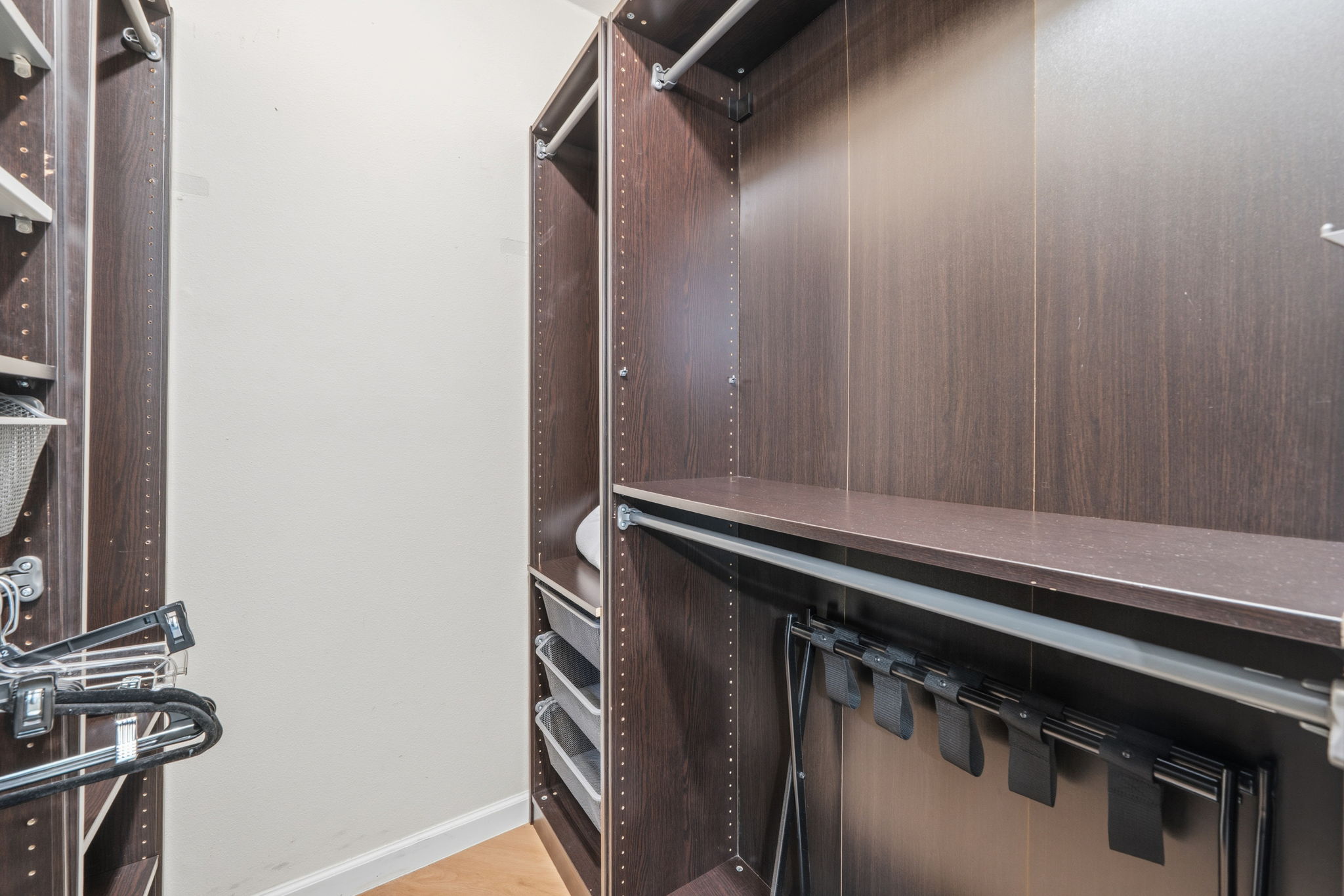 705 Dulwich Street Austin, TX 78748 - Photo 16 of 36 Ample shelving and hanging space defines this highly functional, custom-designed walk-in closet system.