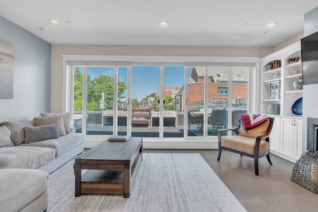 199 West 8th Street, Unit 6 Boston, MA 02127 - Photo 11 of 28 a living room with furniture and a floor to ceiling window