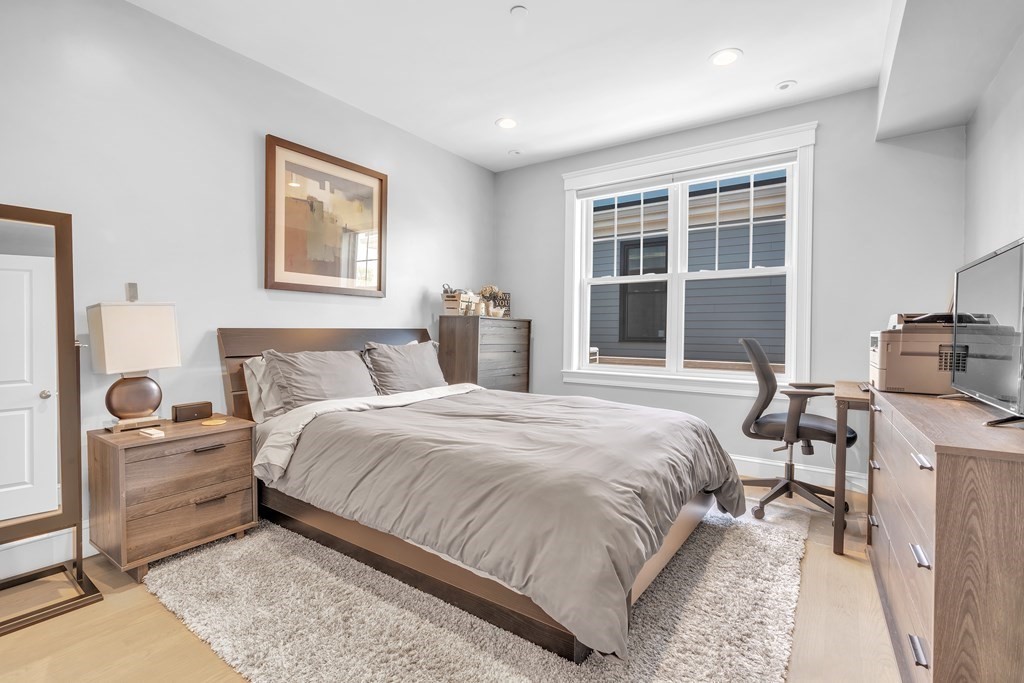 199 West 8th Street, Unit 6 Boston, MA 02127 - Photo 17 of 28 a bedroom with a large bed and a window