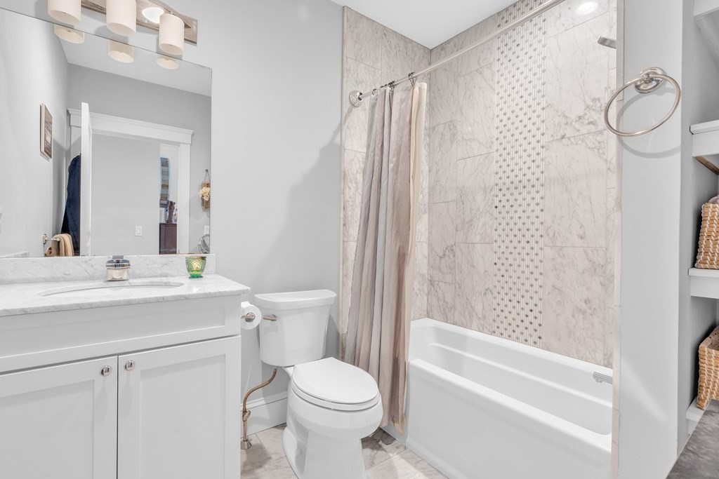 199 West 8th Street, Unit 6 Boston, MA 02127 - Photo 18 of 28 a bathroom with a sink a toilet and shower