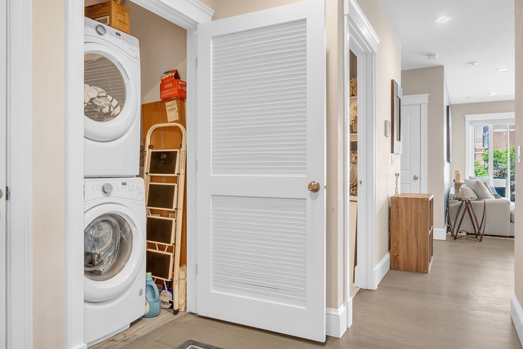 199 West 8th Street, Unit 6 Boston, MA 02127 - Photo 19 of 28 a view of a hallway with washer and dryer