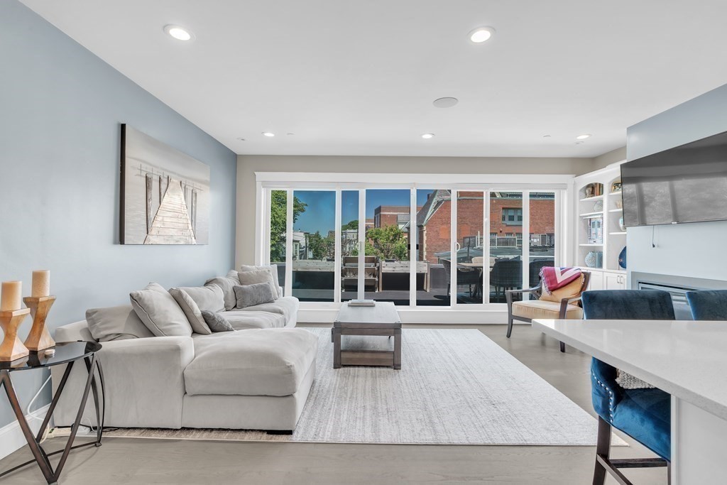 199 West 8th Street, Unit 6 Boston, MA 02127 - Photo 8 of 28 a living room with furniture and a flat screen tv
