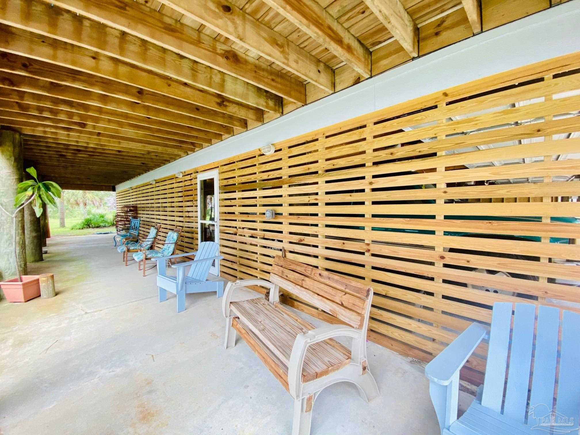 1131 Pearson Road Milton, FL 32583 - Photo 16 of 33 Covered porch perfect for backyard entertaining
