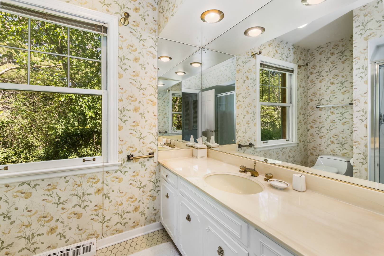 222 Summerfield Road Northbrook, IL 60062 - Photo 14 of 23 a bathroom with a granite countertop sink mirror and a shower