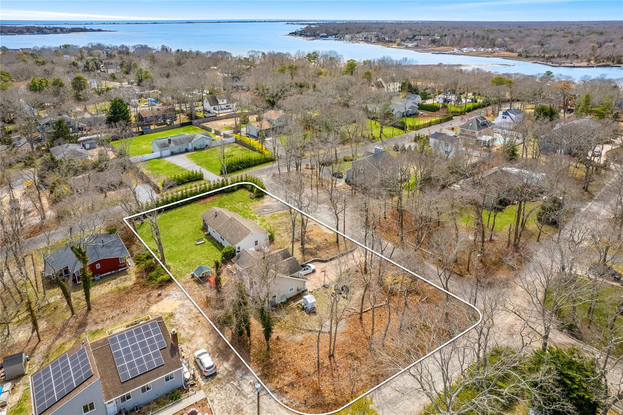 an aerial view of houses with a swimming pool