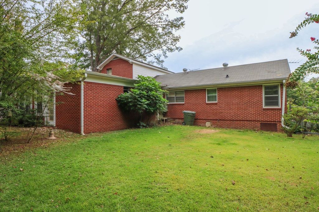 533 Best Street Ripley, TN 38063 - Photo 3 of 27 a front view of a house with garden