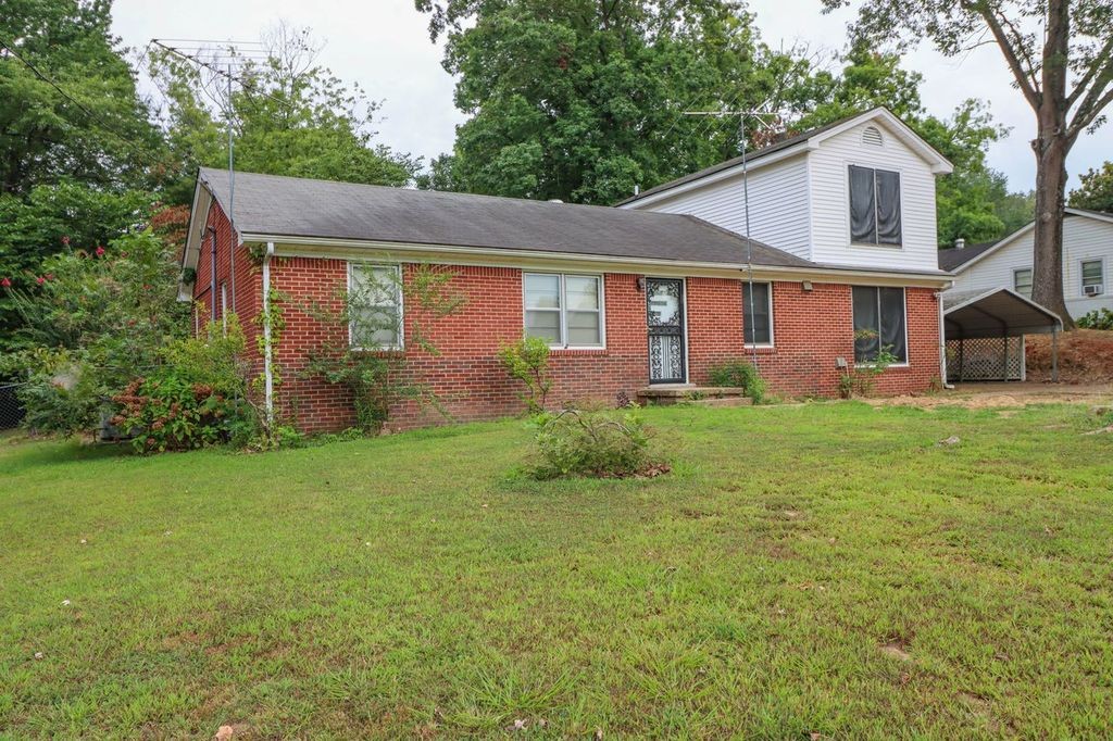 533 Best Street Ripley, TN 38063 - Photo 5 of 27 a front view of a house with garden