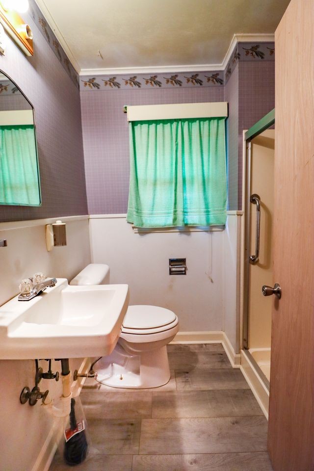 533 Best Street Ripley, TN 38063 - Photo 6 of 27 a bathroom with a sink a toilet and tub