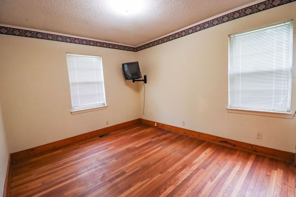 533 Best Street Ripley, TN 38063 - Photo 7 of 27 a view of empty room with wooden floor and fan