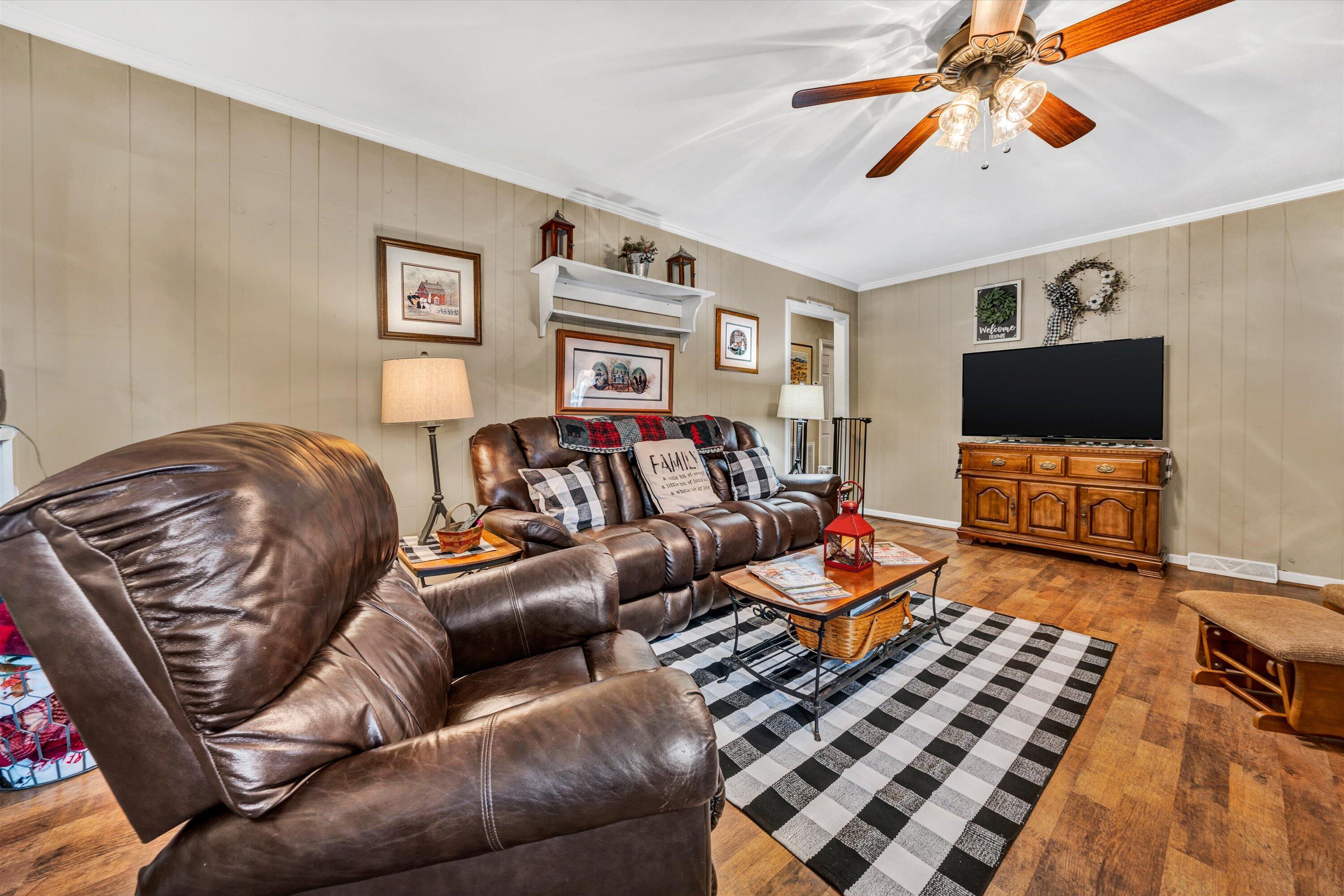 87 Queen Regent Court Blue Ridge, VA 24064 - Photo 12 of 38 a living room with furniture and a flat screen tv