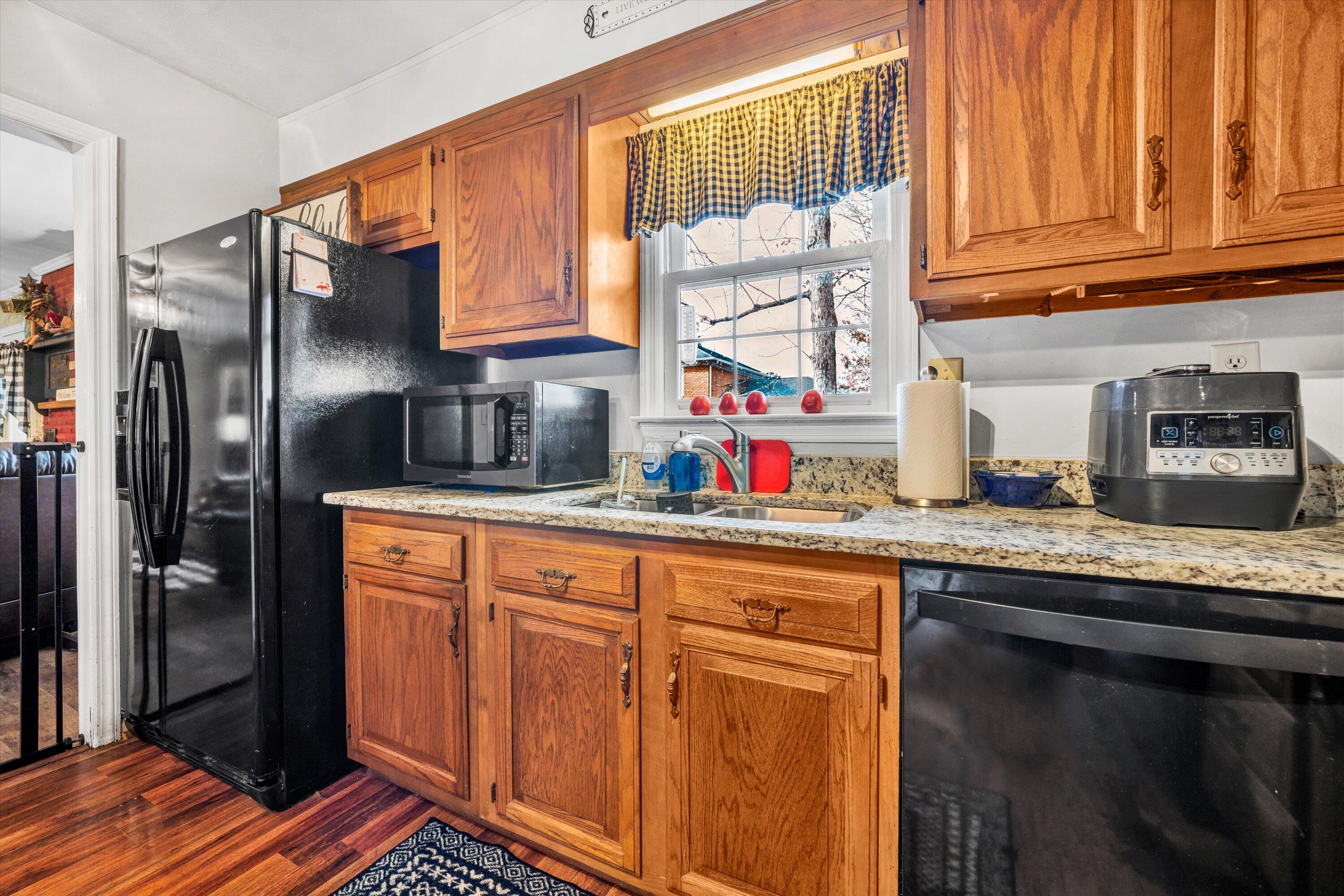 87 Queen Regent Court Blue Ridge, VA 24064 - Photo 15 of 38 a kitchen with stainless steel appliances granite countertop a refrigerator and a sink