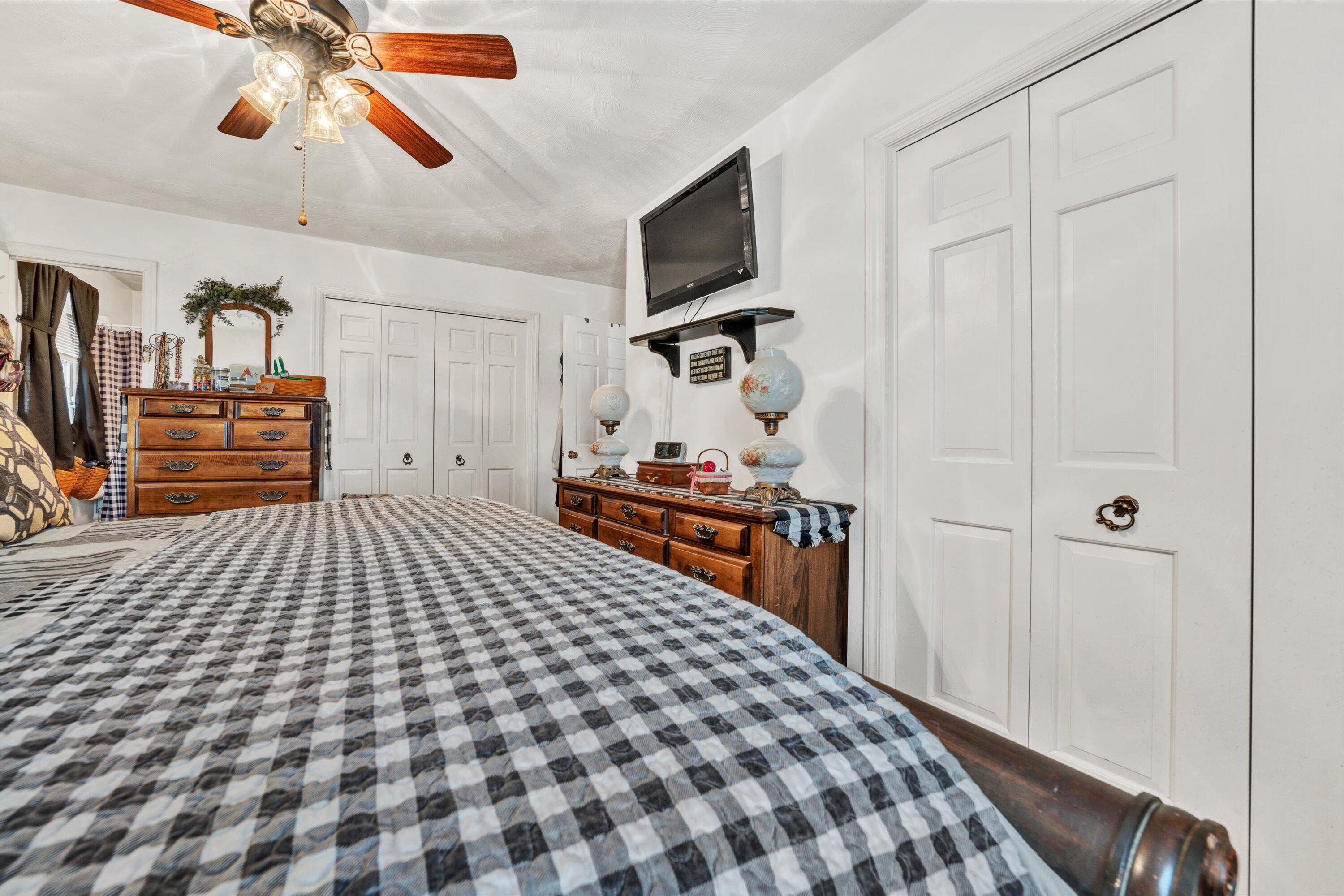 87 Queen Regent Court Blue Ridge, VA 24064 - Photo 20 of 38 a bedroom with a bed and dresser