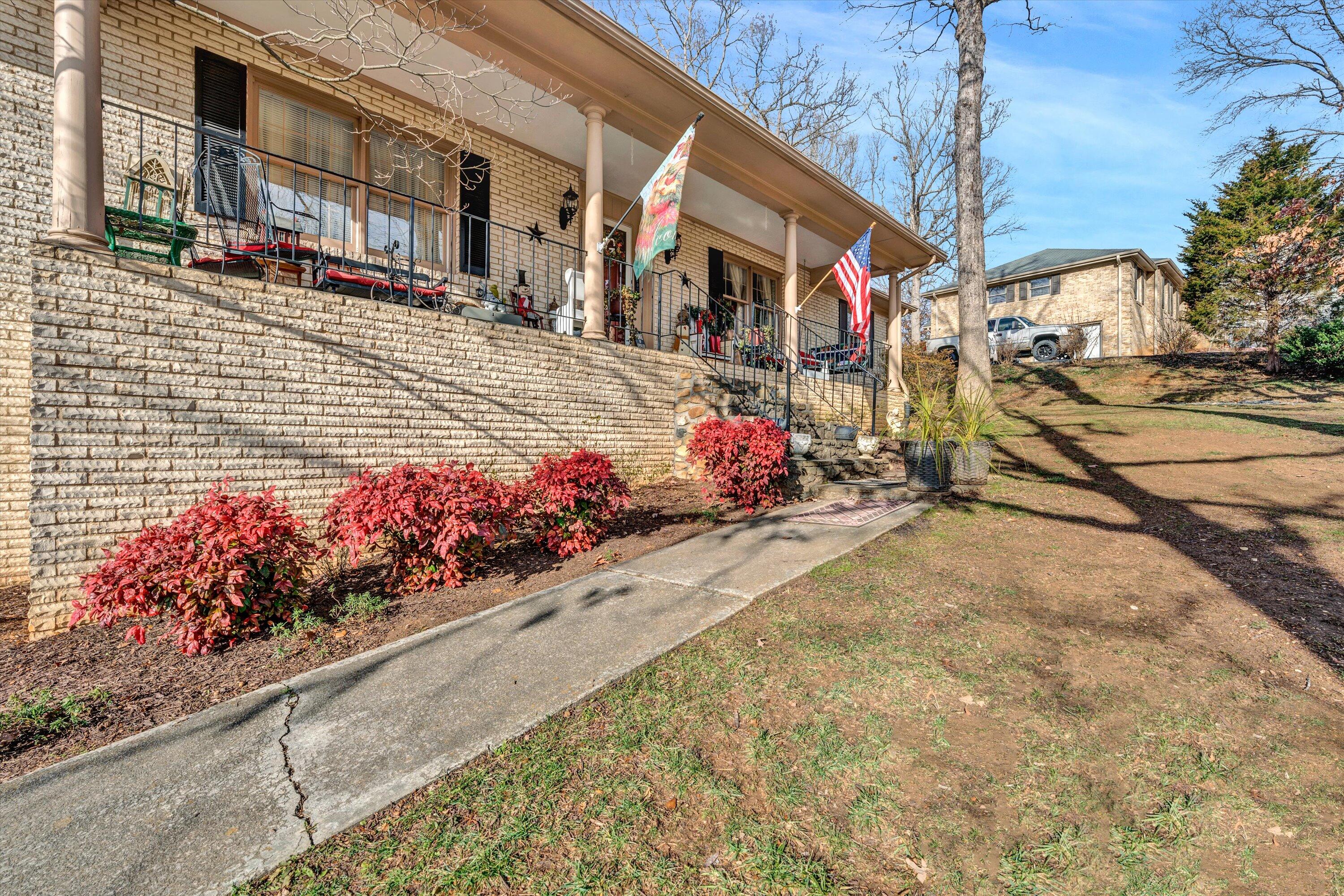 87 Queen Regent Court Blue Ridge, VA 24064 - Photo 3 of 38 a front view of a building with flowers