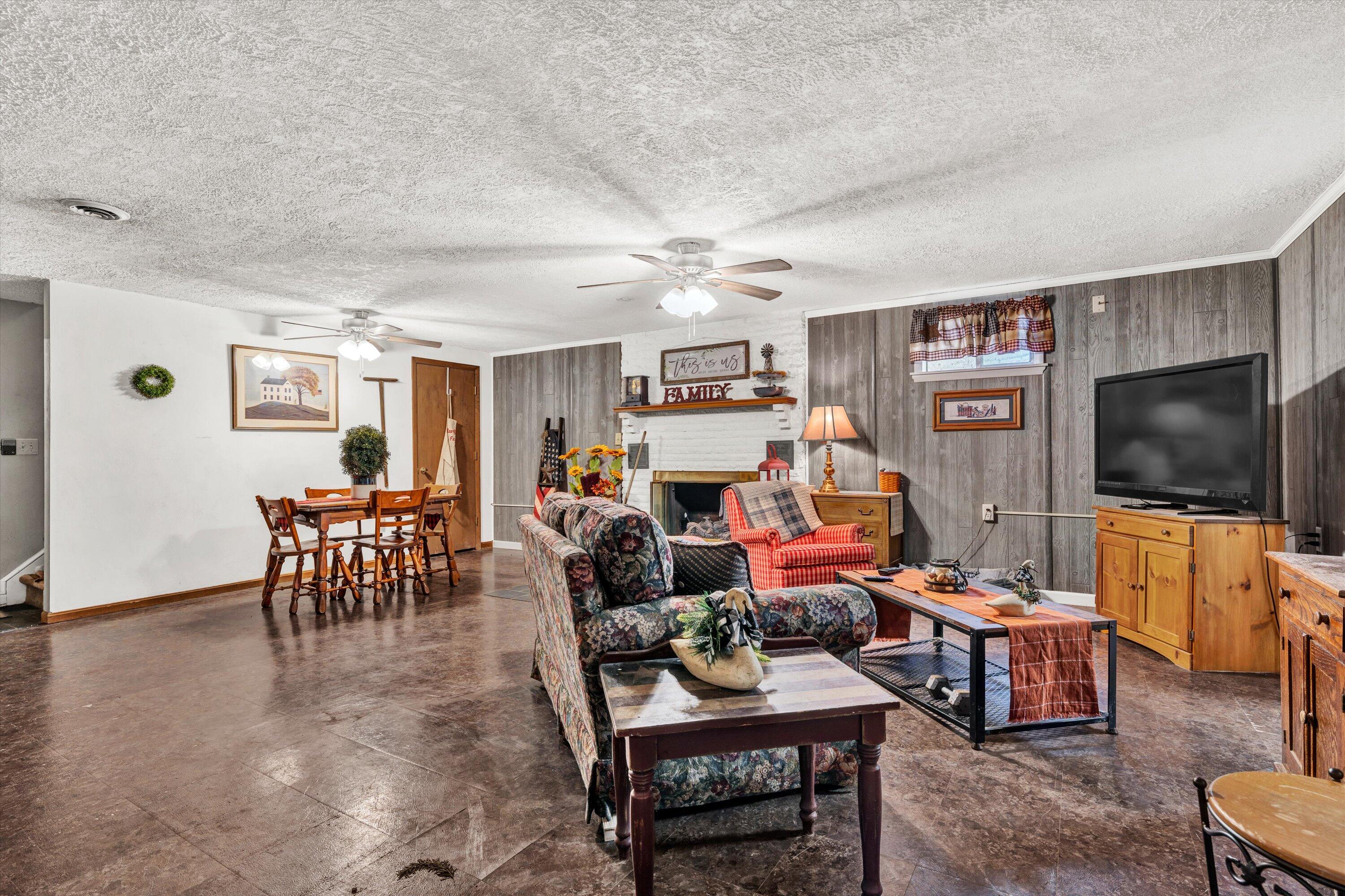 87 Queen Regent Court Blue Ridge, VA 24064 - Photo 31 of 38 a living room with furniture and a flat screen tv